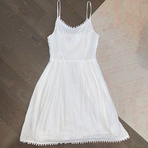 A white, Eyelet, spaghetti strap dress.